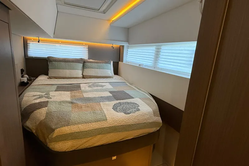Slide: The Image of Cozy bedroom in 2024 Leopard 45 yacht with quilted bedding and modern lighting. - 40