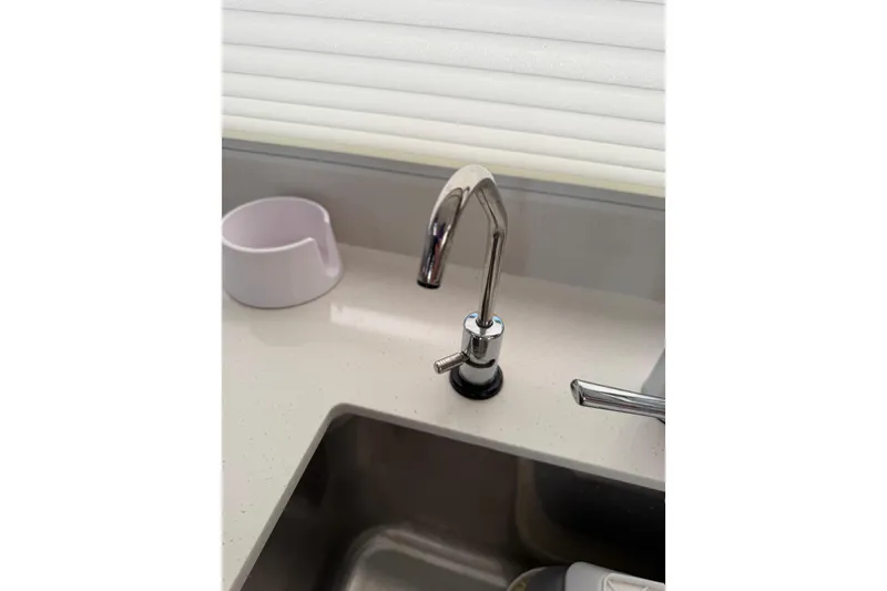Slide: The Image of Modern kitchen sink faucet in 2024 Leopard 45 yacht interior. - 41