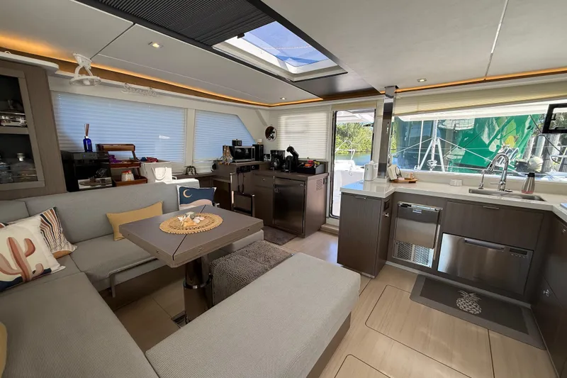 Slide: The Image of Luxurious interior of 2024 Leopard 45 catamaran with modern kitchen and cozy seating area. - 42