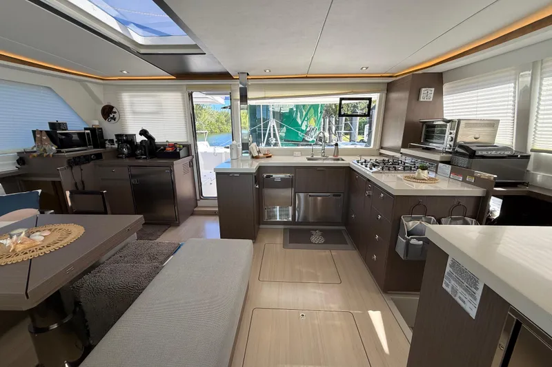 Slide: The Image of Luxurious interior of 2024 Leopard 45 yacht featuring modern kitchen and dining area. - 43