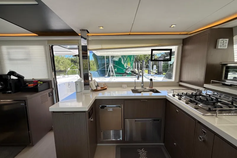Slide: The Image of Modern kitchen interior on 2024 Leopard 45 yacht with sleek appliances and large windows. - 49