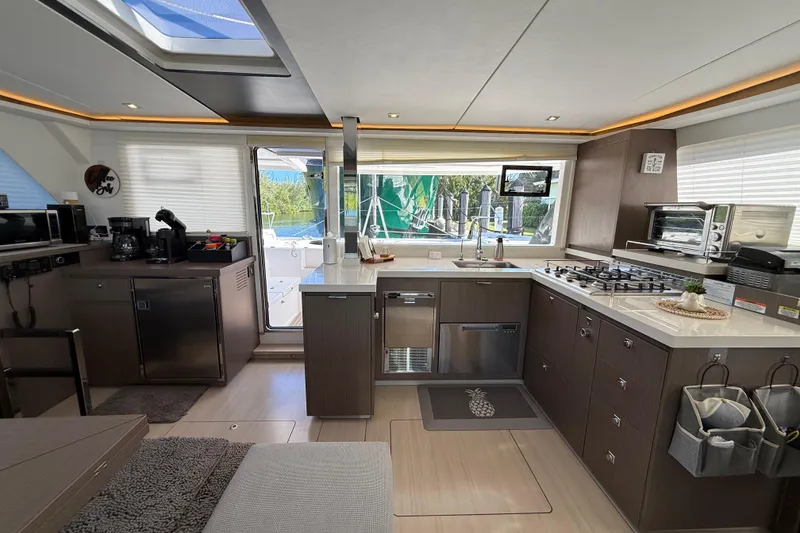Slide: The Image of Modern kitchen interior of 2024 Leopard 45 yacht with sleek appliances and ample natural light. - 51