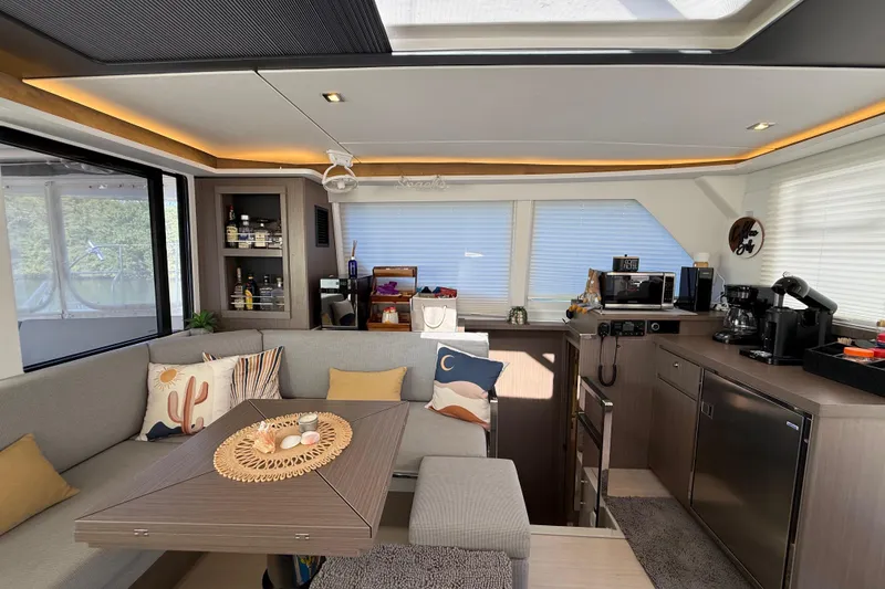 Slide: The Image of Modern interior of 2024 Leopard 45 yacht with cozy seating and kitchen amenities. - 54