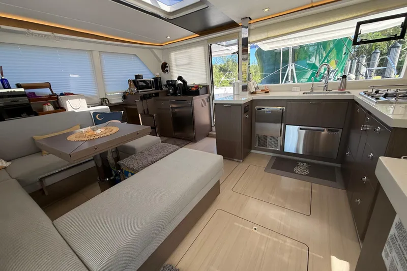 Slide: The Image of Luxurious interior of 2024 Leopard 45 yacht featuring modern kitchen and seating area. - 55