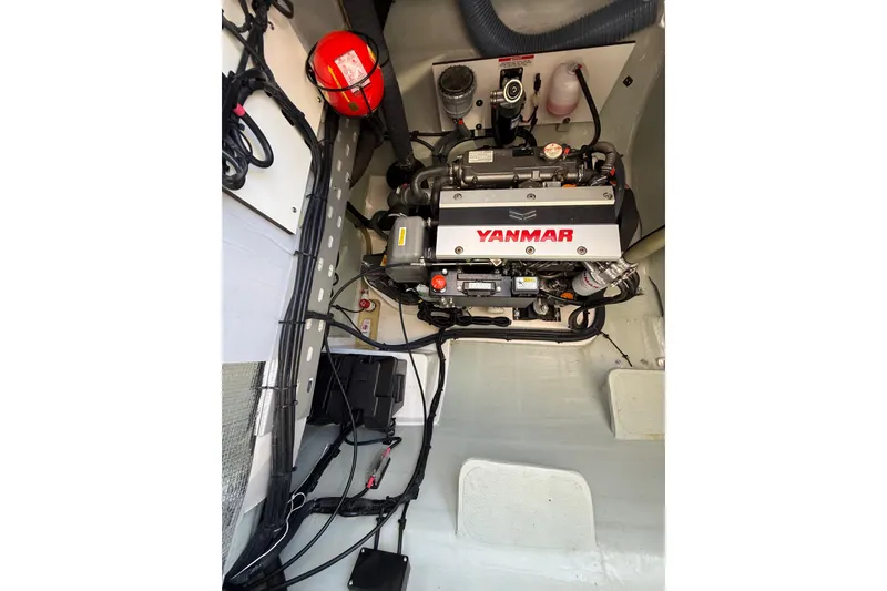 Slide: The Image of Engine compartment of 2024 Leopard 45 with Yanmar engine and fire extinguisher. - 56