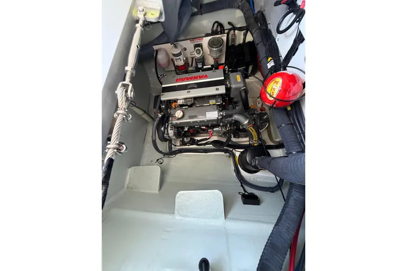 Slide: The Image of Engine compartment of 2024 Leopard 45 yacht, featuring a Yanmar engine and safety equipment. - 57