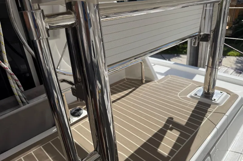 Slide: The Image of 2024 Leopard 45 yacht deck with stainless steel railing and teak flooring. - 6