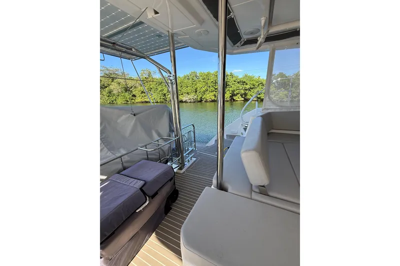 Slide: The Image of Luxurious 2024 Leopard 45 yacht interior with comfortable seating and scenic water view. - 61