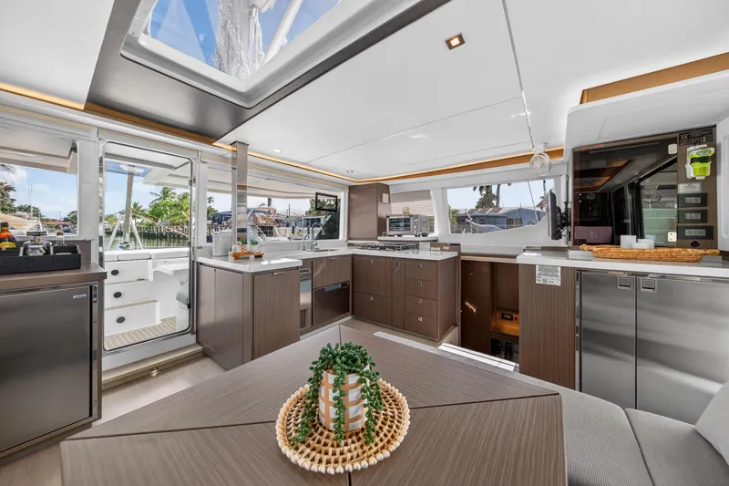Slide: The Image of Luxurious interior of 2024 Leopard 45 catamaran featuring modern kitchen and dining area. - 67