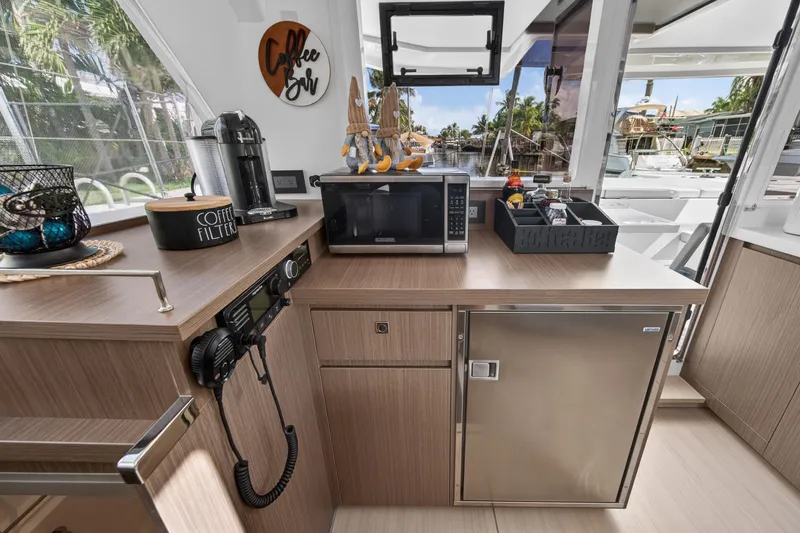 Slide: The Image of Modern kitchen area on a 2024 Leopard 45 yacht with appliances and scenic view. - 69