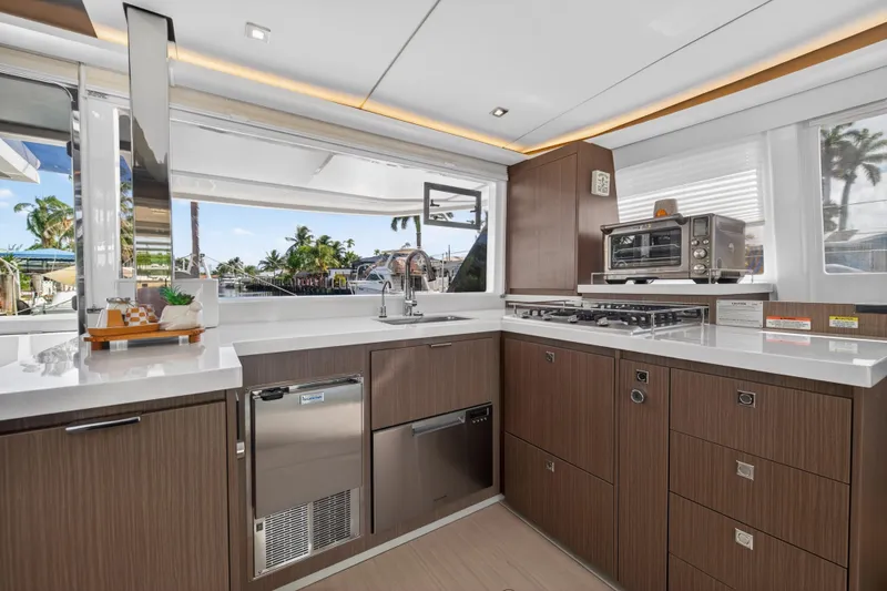 Slide: The Image of Modern kitchen interior on 2024 Leopard 45 yacht, featuring sleek cabinetry and appliances. - 71