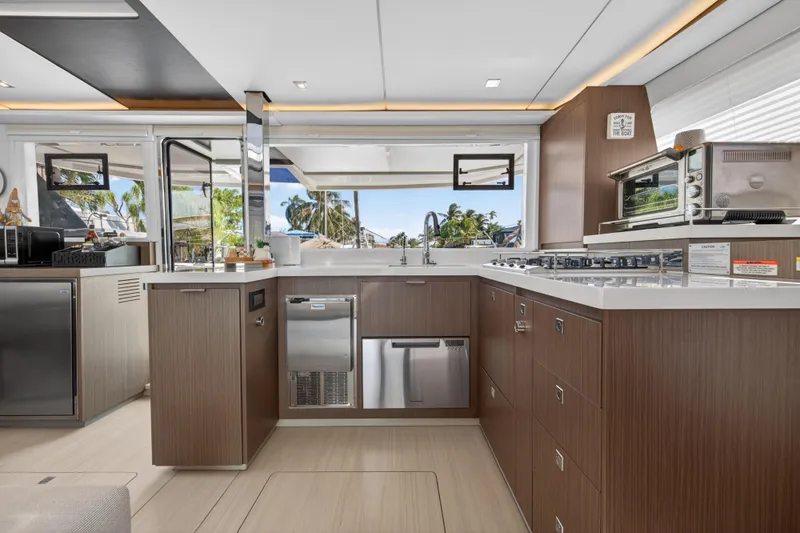 Slide: The Image of Modern kitchen interior on 2024 Leopard 45 yacht, featuring sleek cabinetry and appliances. - 72