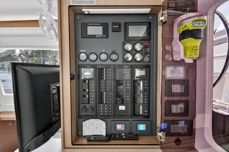 Slide: The Image of Electrical control panel on a 2024 Leopard 45 yacht, featuring gauges and switches. - 79