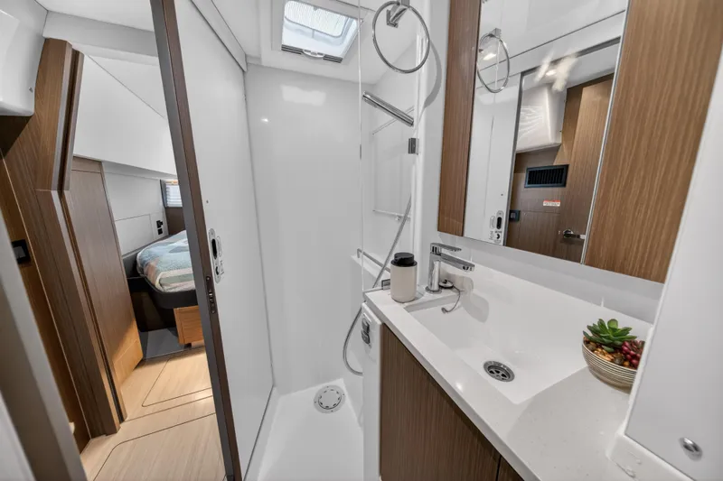Slide: The Image of Modern bathroom interior on 2024 Leopard 45 yacht, featuring sleek design and wooden accents. - 89