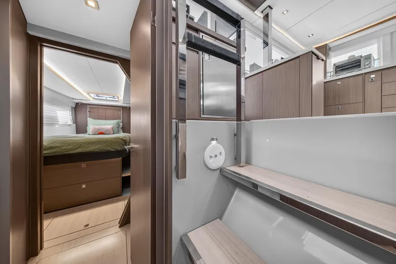 Slide: The Image of Luxurious interior of 2024 Leopard 45 yacht, featuring modern bedroom and sleek cabinetry. - 90