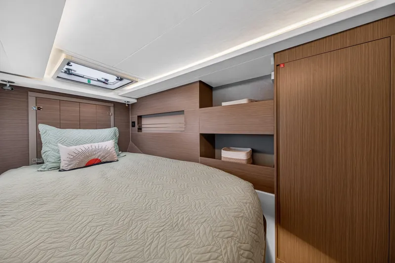 Slide: The Image of 2024 Leopard 45 yacht interior cabin with modern design and cozy bedding. - 92