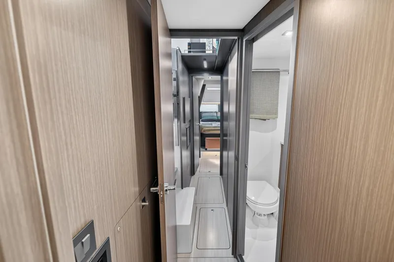 Slide: The Image of Interior view of 2024 Leopard 45 yacht, featuring modern hallway and bathroom. - 93