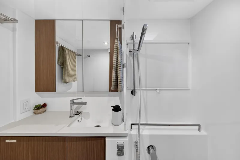 Slide: The Image of Modern bathroom in 2024 Leopard 45 yacht with sleek fixtures and wooden accents. - 95