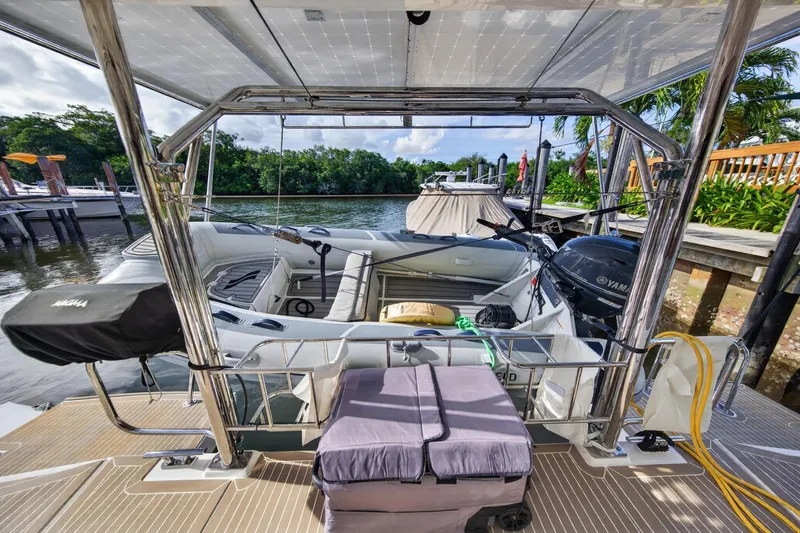 Slide: The Image of 2024 Leopard 45 yacht docked, featuring spacious deck and Yamaha engine. - 97