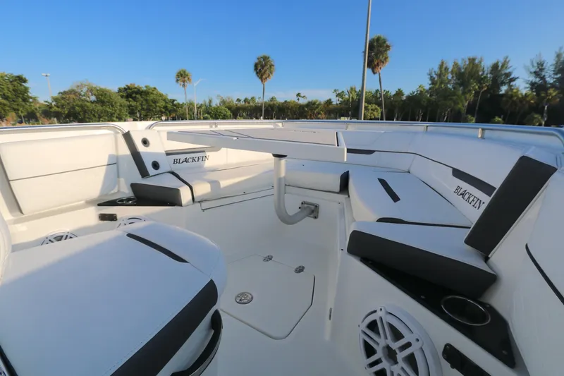 Slide: The Image of 2021 Blackfin 252 CC boat interior with white seating and cup holders. - 5