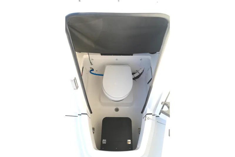 Slide: The Image of 2021 Blackfin 252 CC boat interior with compact marine toilet. - 7