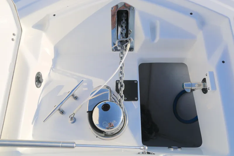 Slide: The Image of 2021 Blackfin 252 CC boat anchor system with chain and cleat. - 9