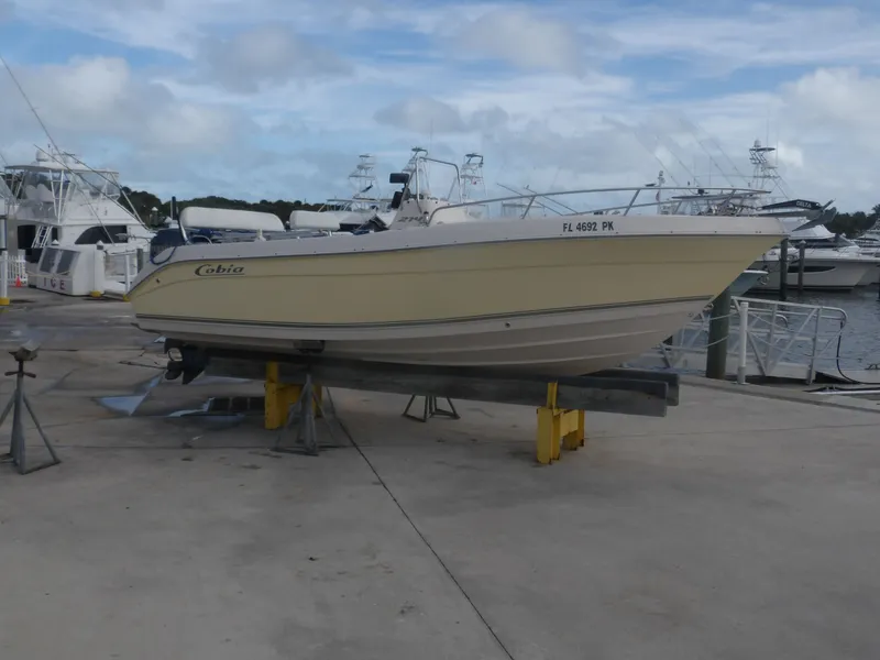 The Image of 2006 Cobia 214 Center Console boat on a dock. - 0