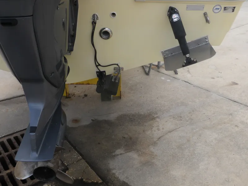 Slide: The Image of Rear view of 2006 Cobia 214 Center Console boat with outboard motor. - 10