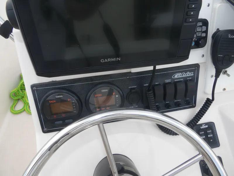 Slide: The Image of Dashboard of a 2006 Cobia 214 Center Console boat. - 13