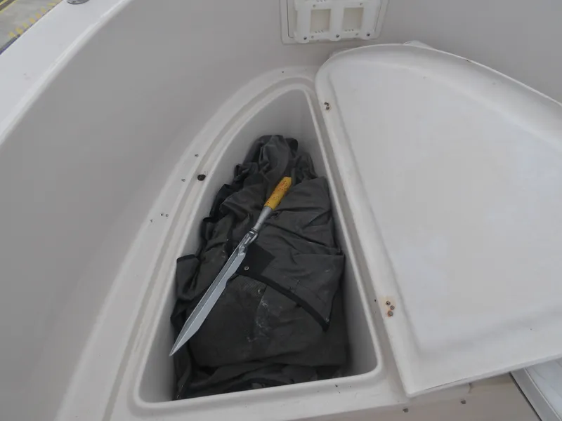 Slide: The Image of Storage compartment in 2006 Cobia 214 Center Console boat. - 21