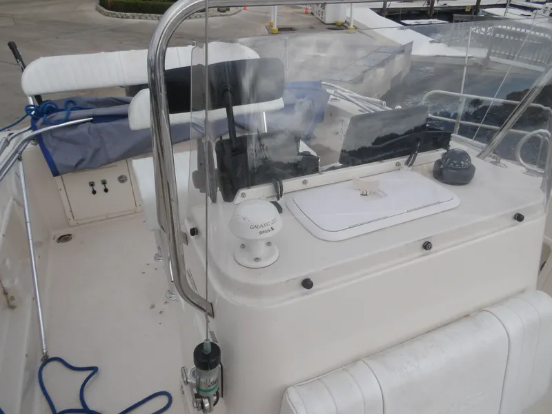 Slide: The Image of 2006 Cobia 214 Center Console boat with helm and equipment. - 25