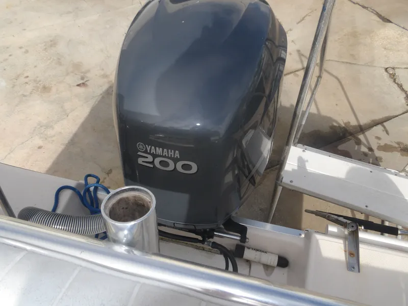 Slide: The Image of Yamaha 200 outboard motor on 2006 Cobia 214 Center Console. - 34