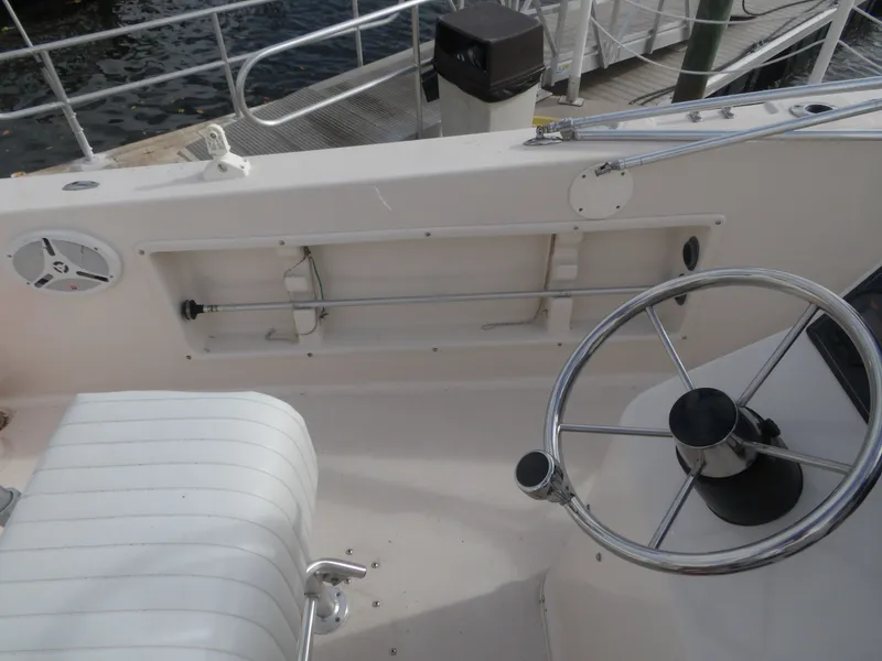 Slide: The Image of Steering area of a 2006 Cobia 214 Center Console boat. - 36