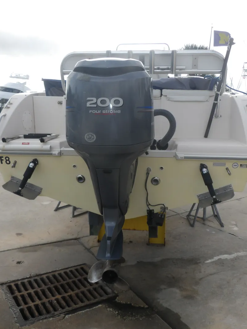 Slide: The Image of 2006 Cobia 214 Center Console with 200 HP outboard motor. - 5