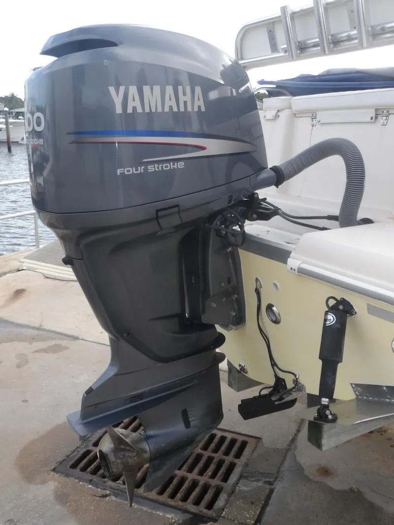 Slide: The Image of Yamaha outboard motor on a 2006 Cobia 214 Center Console boat. - 6