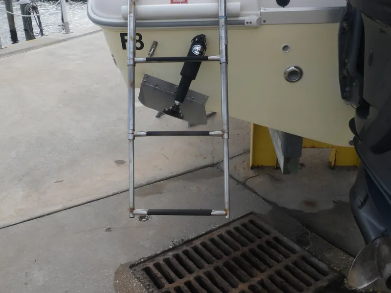 Slide: The Image of Ladder on a 2006 Cobia 214 Center Console boat. - 9
