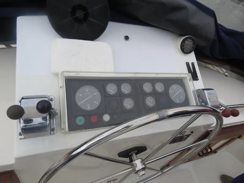 Slide: The Image of 1987 DeFever 49 Pilothouse helm with instrument panel. - 18