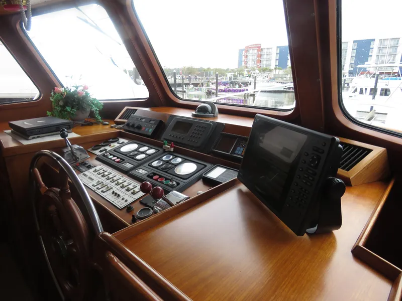 Slide: The Image of 1987 DeFever 49 Pilothouse helm with navigation instruments. - 20