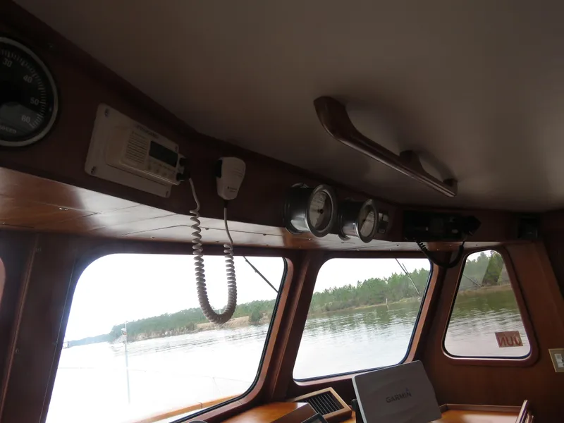 Slide: The Image of Interior view of 1987 DeFever 49 Pilothouse with navigation instruments. - 24