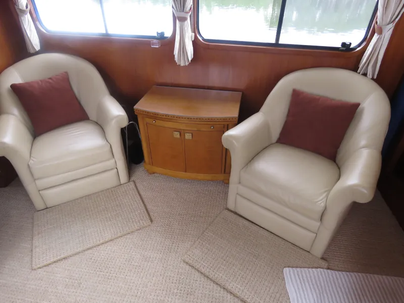 Slide: The Image of Interior of 1987 DeFever 49 Pilothouse yacht with two armchairs. - 28