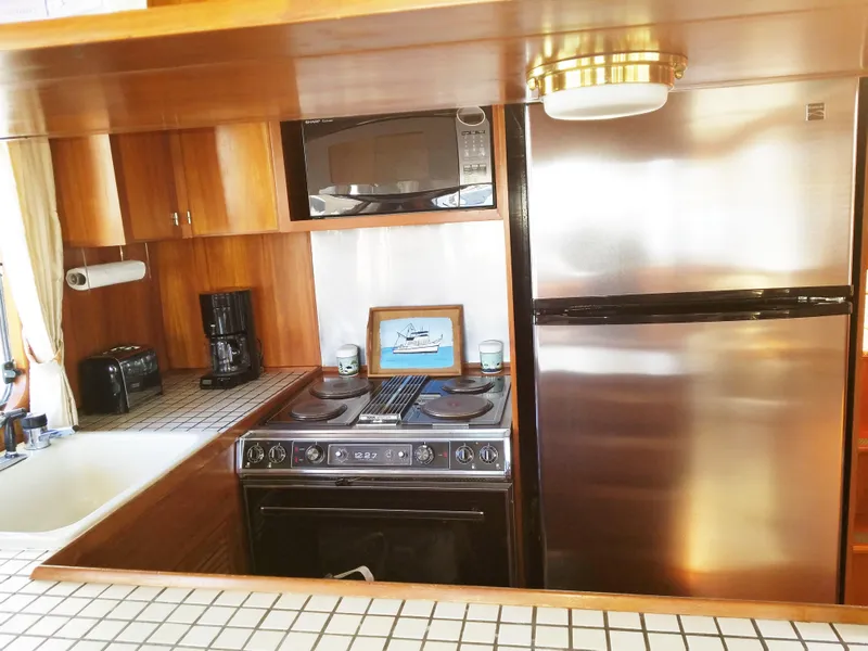 Slide: The Image of 1987 DeFever 49 Pilothouse yacht kitchen interior. - 30