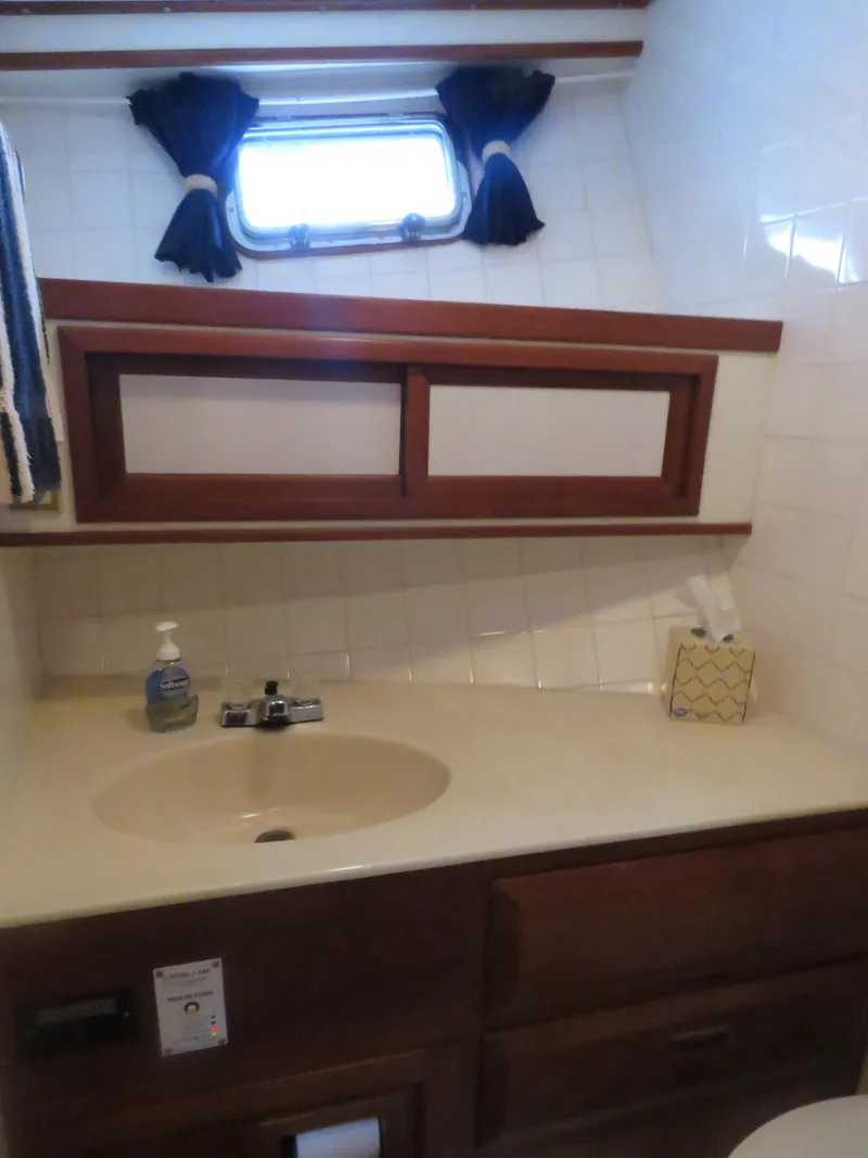 Slide: The Image of Bathroom in 1987 DeFever 49 Pilothouse with sink and window. - 34