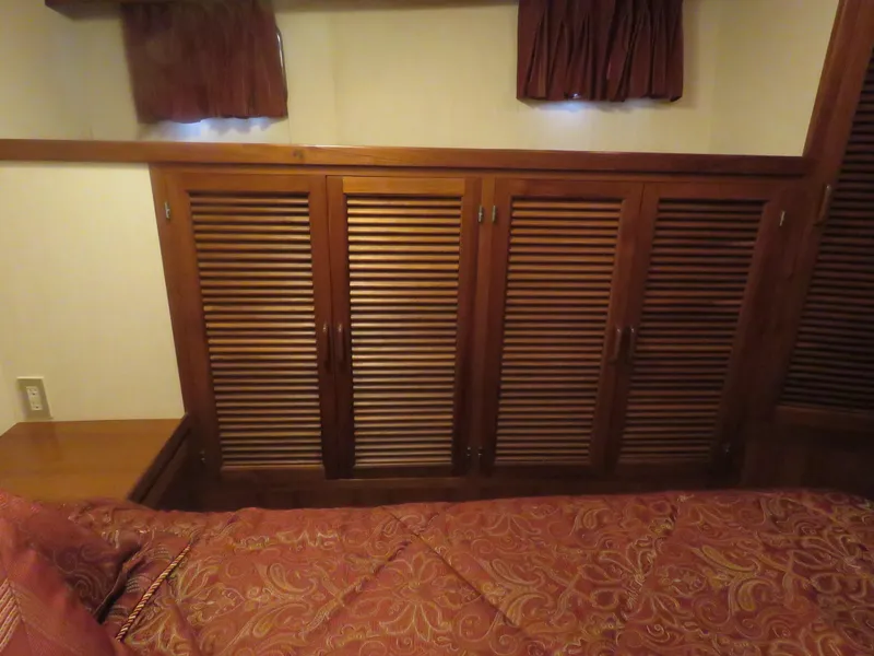 Slide: The Image of 1987 DeFever 49 Pilothouse interior with wooden furnishings. - 37