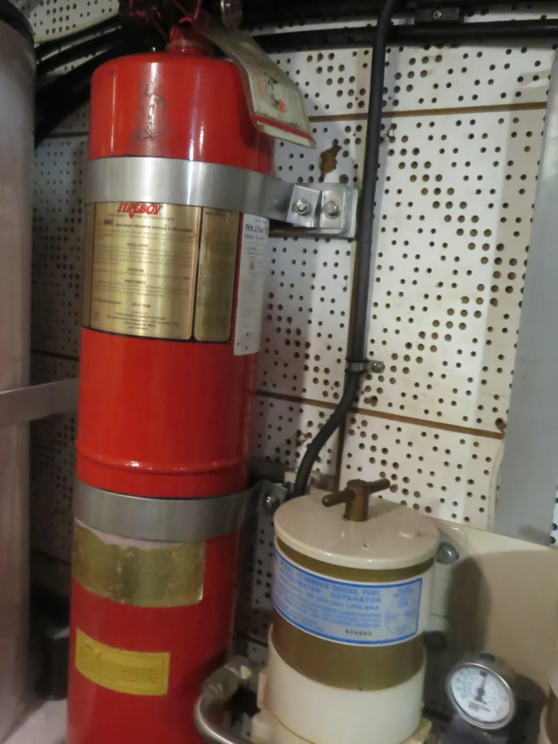 Slide: The Image of Fire extinguisher and equipment in DeFever 49 Pilothouse, 1987 model. - 43