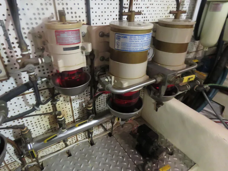 Slide: The Image of DeFever 49 Pilothouse 1987 engine room with fuel filters. - 46