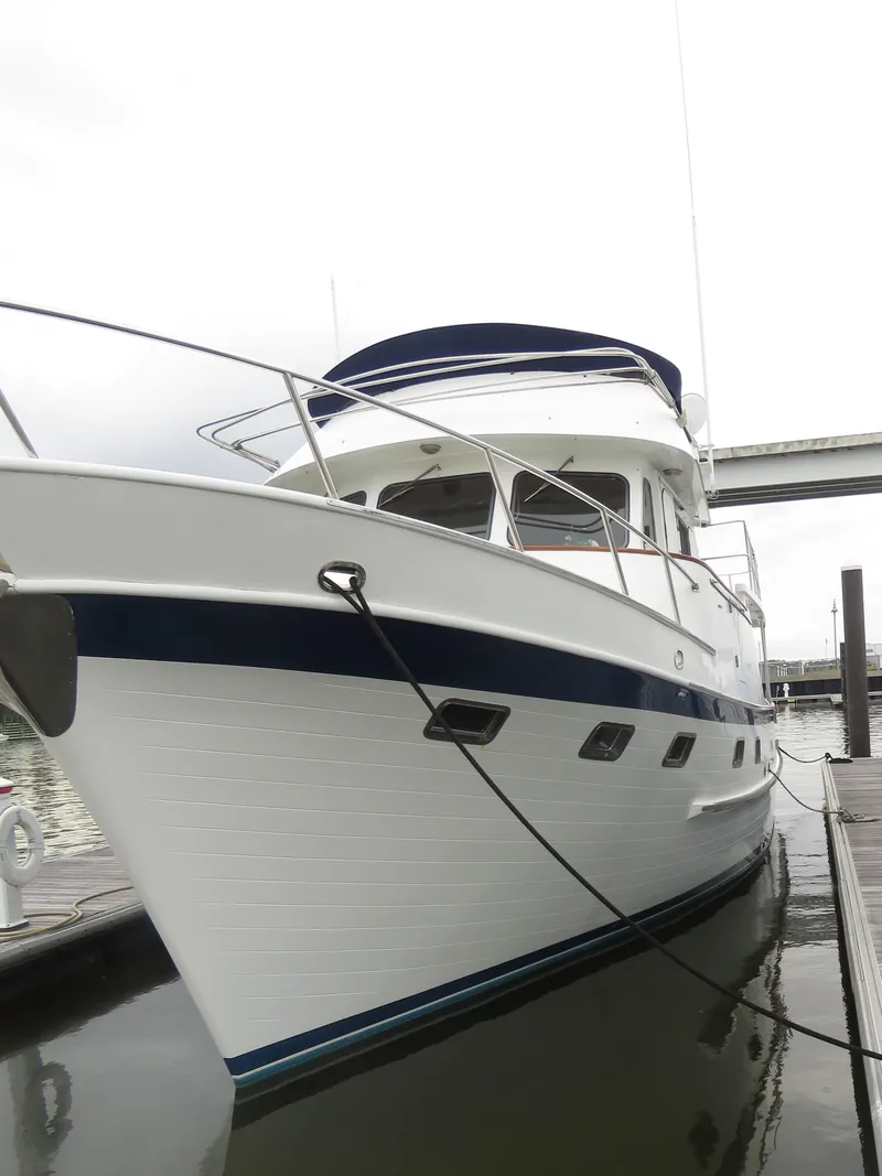 Slide: The Image of 1987 DeFever 49 Pilothouse yacht docked. - 6
