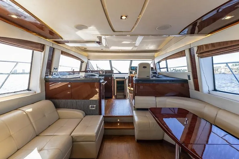 Slide: The Image of Luxurious interior of 2016 Sea Ray 510 Fly yacht with elegant seating and panoramic windows. - 10