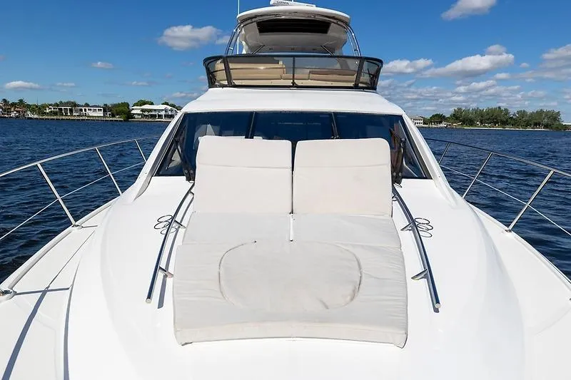 Slide: The Image of 2016 Sea Ray 510 Fly yacht with sunbathing deck on calm water. - 15