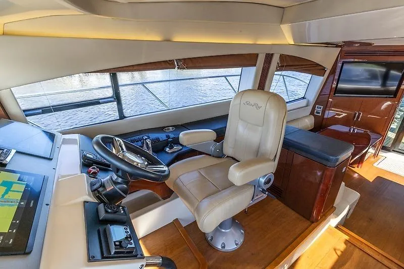 Slide: The Image of Luxurious helm of 2016 Sea Ray 510 Fly yacht with leather captain's chair. - 5
