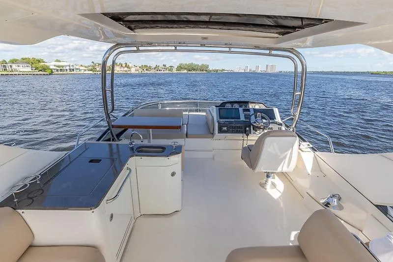 Slide: The Image of Flybridge view of 2016 Sea Ray 510 Fly yacht on open water. - 7